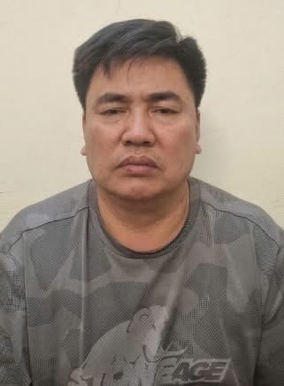 Khởi tố đối tượng đẩy cảnh sát giao thông vào đầu xe tải- Ảnh 1.