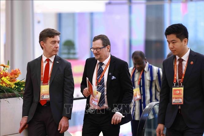 Đại biểu đến dự khai mạc Đại hội XIV của Đảng- Ảnh 10.