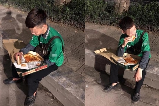 Hình ảnh nam shipper ngồi vỉa hè ăn miếng pizza do khách 'bùng hàng' khiến tất cả bức xúc