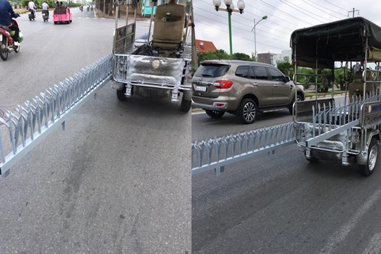 Xe ba gác chở hàng rào sắt dài ngang nhiên di chuyển trên phố khiến nhiều người kinh hãi