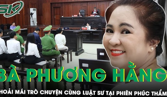 Hình ảnh bà Nguyễn Phương Hằng mặc áo trắng, tóc búi cao tại phiên tòa phúc thẩm