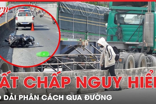 Dù đã xảy ra tai nạn, người dân bất chấp leo dải phân cách qua đường