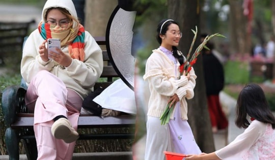 Trời rét đậm 10 độ C, nhiều 'nàng thơ' vẫn thướt tha áo dài chụp ảnh Tết trên phố đi bộ Hồ Gươm