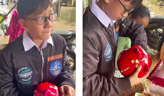 Xúc động hình ảnh cậu bé bẽn lẽn ôm heo đất đến ủng hộ bà con vùng 'tâm lũ'