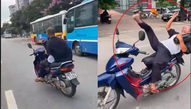 Clip: Người đàn ông nằm trên yên, lái xe bằng chân trên phố Hà Nội gây phẫn nộ