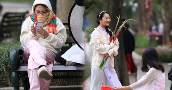 Trời rét đậm 10 độ C, nhiều 'nàng thơ' vẫn thướt tha áo dài chụp ảnh Tết trên phố đi bộ Hồ Gươm